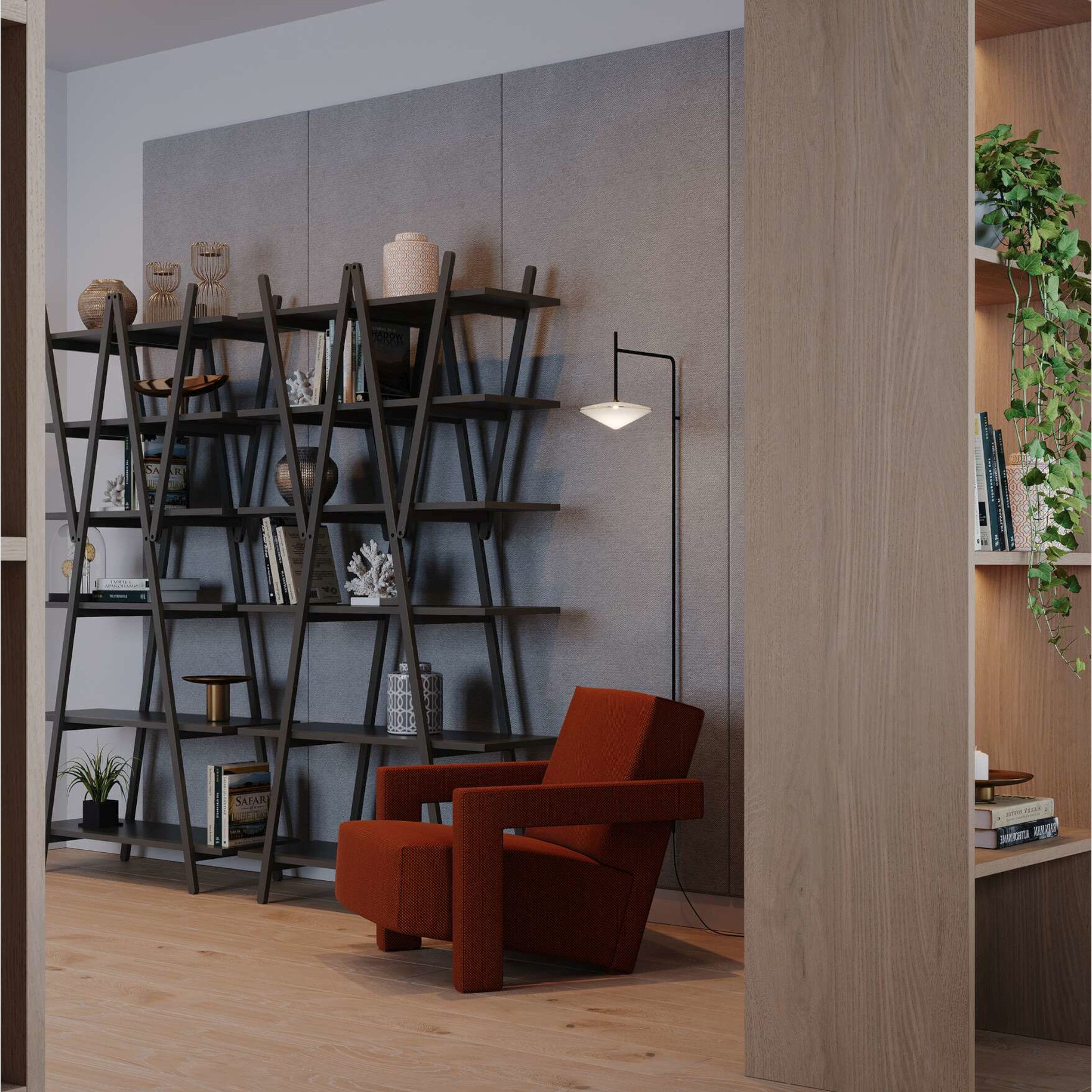 Ein gemütliches Wohnzimmer mit einem einladenden roten Sessel Utrecht und Bücherregalen La Nuvola Rossa von Cassina.