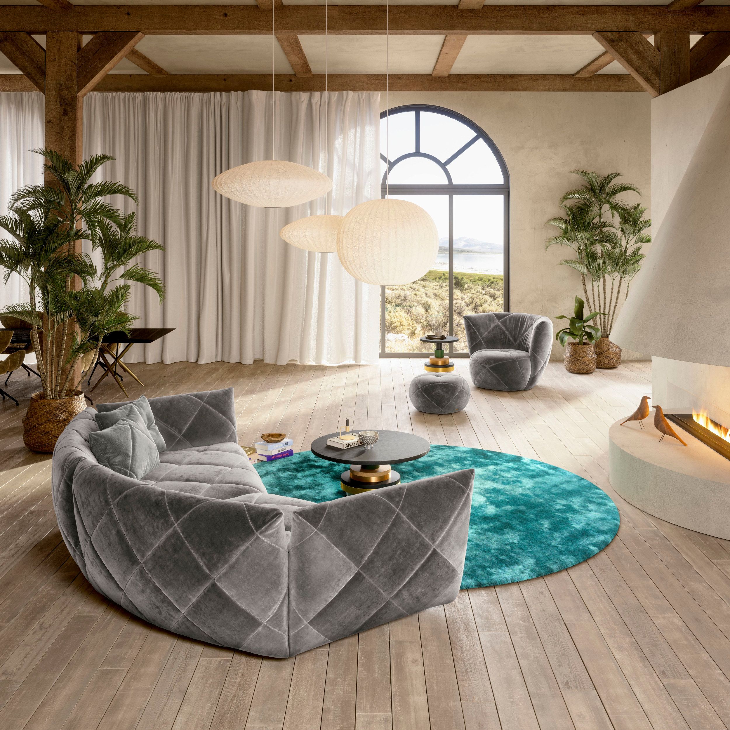 Sofa Teratai von Bretz als Milieubild mit passendem Sessel in grau